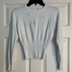 White Sweater with Floral Embellishments